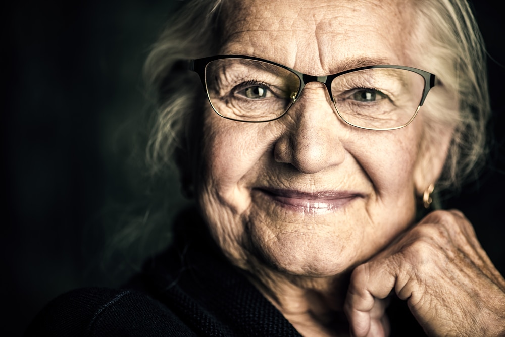 Portrait,Of,A,Beautiful,Senior,Woman,In,Elegant,Glasses,Smiling Happy lady